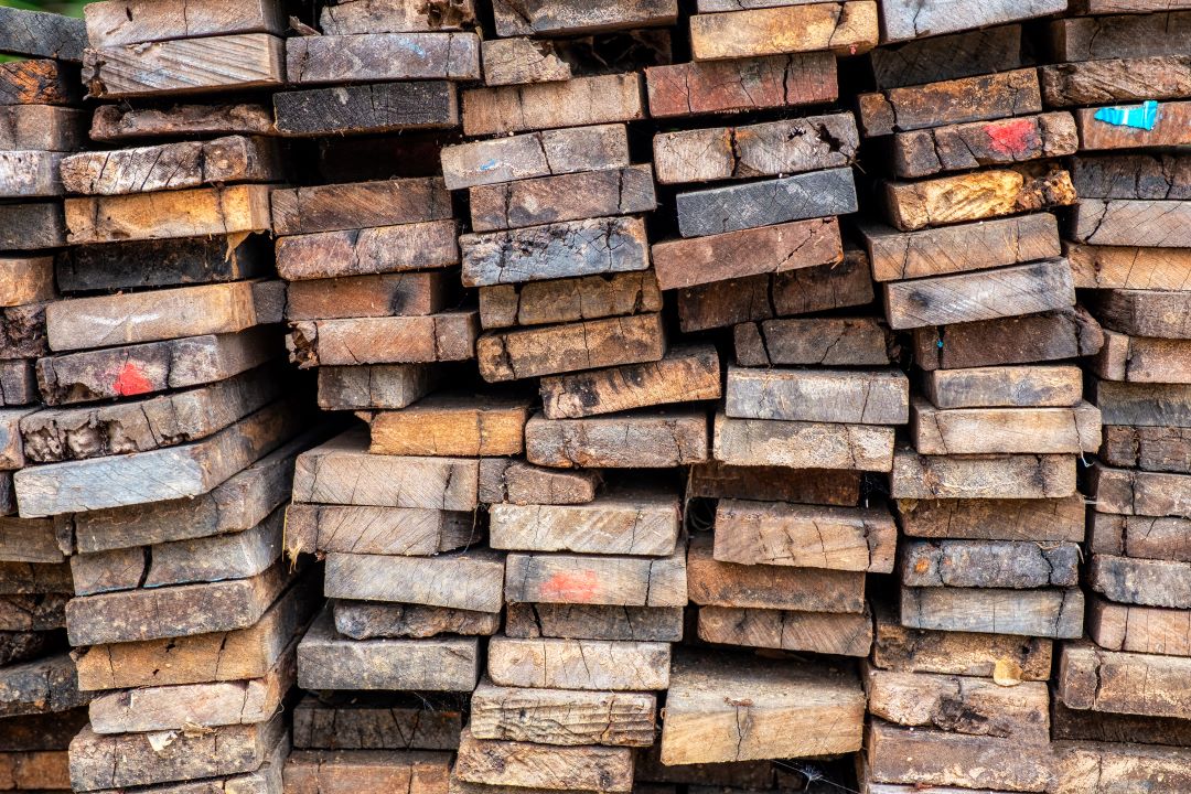 Stack of reclaimed wood, a sustainable material used in home remodeling.